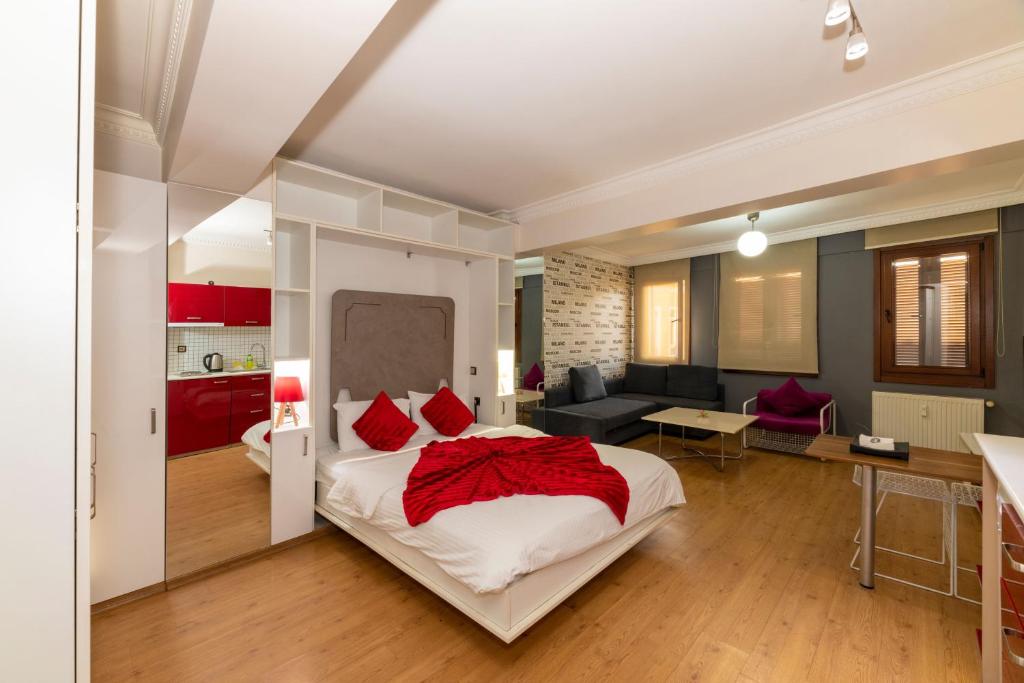 a bedroom with a bed and a living room at Taksim full House in Istanbul