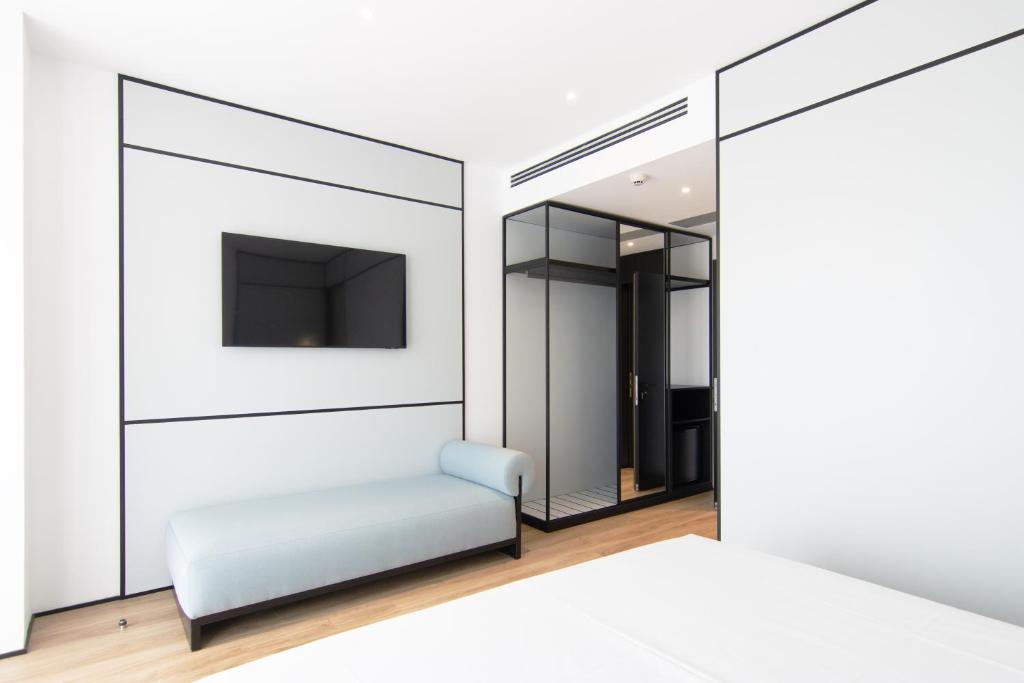 TV a/nebo společenská místnost v ubytování Mango Luxury Resorts