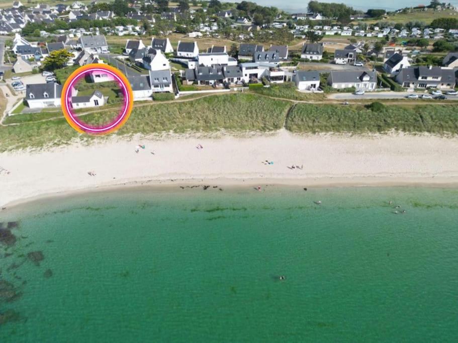 a pink frisbee flying over a beach with houses at Beach House - jusqu'à 5 personnes in Plouescat