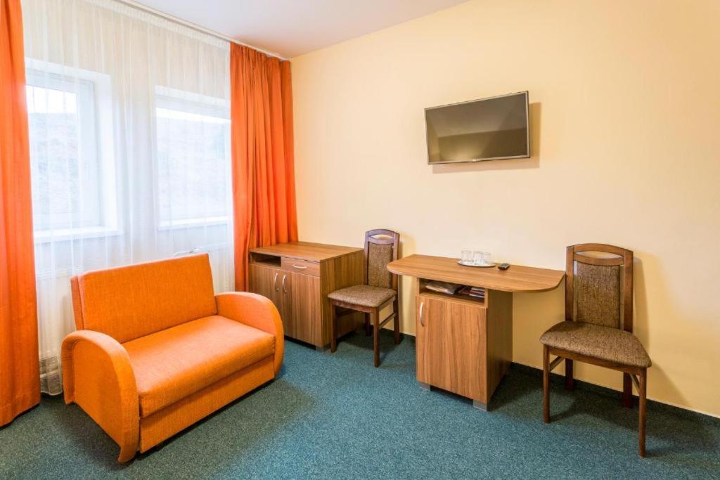 TV a/nebo společenská místnost v ubytování Hotel Sipox