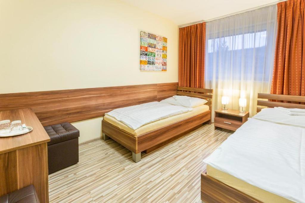 Postel nebo postele na pokoji v ubytování Hotel Sipox