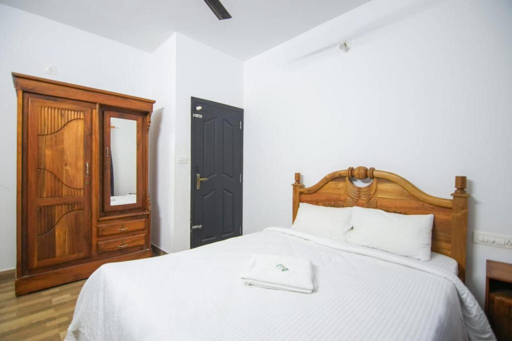 מיטה או מיטות בחדר ב-B'camp Resorts & Homestays