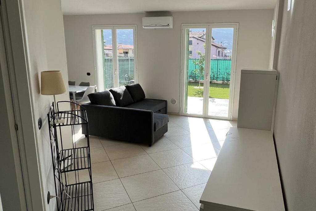 a living room with a couch and a table at Plumosus in Arma di Taggia