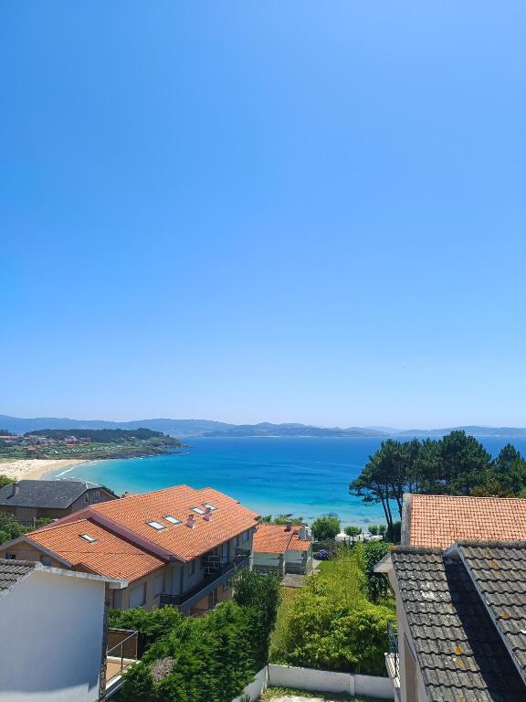 a view of the ocean from a building at La Cruz del Sur - "ONS" in Sanxenxo