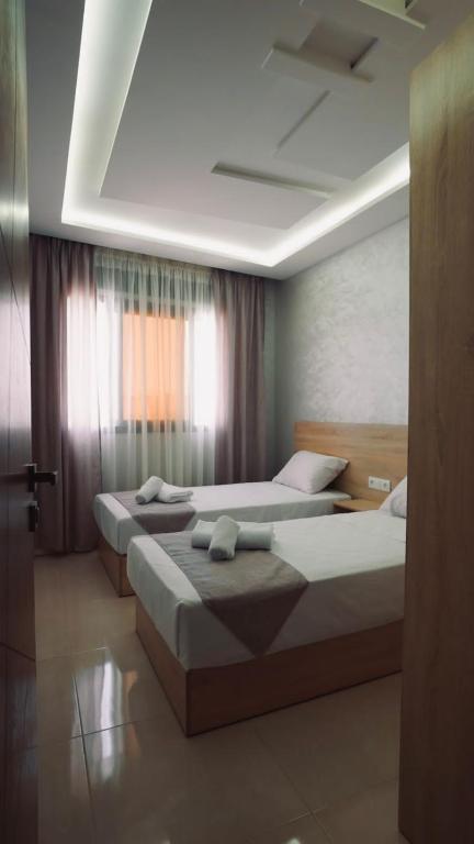 Postel nebo postele na pokoji v ubytování Appartement AL-RIMAL POUR LES FAMILLES