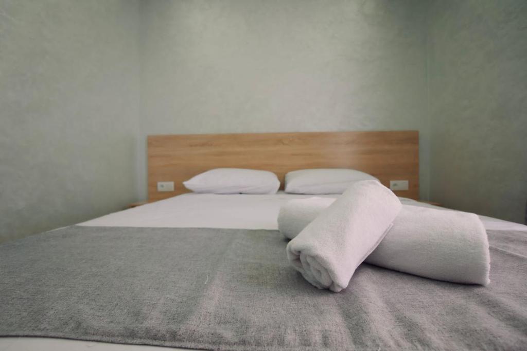 Postel nebo postele na pokoji v ubytování Appartement AL-RIMAL POUR LES FAMILLES