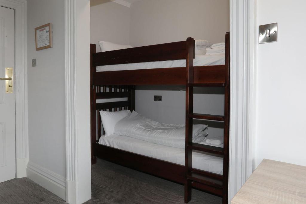 a couple of bunk beds in a room at The Harrogate Inn - The Inn Collection Group in Harrogate