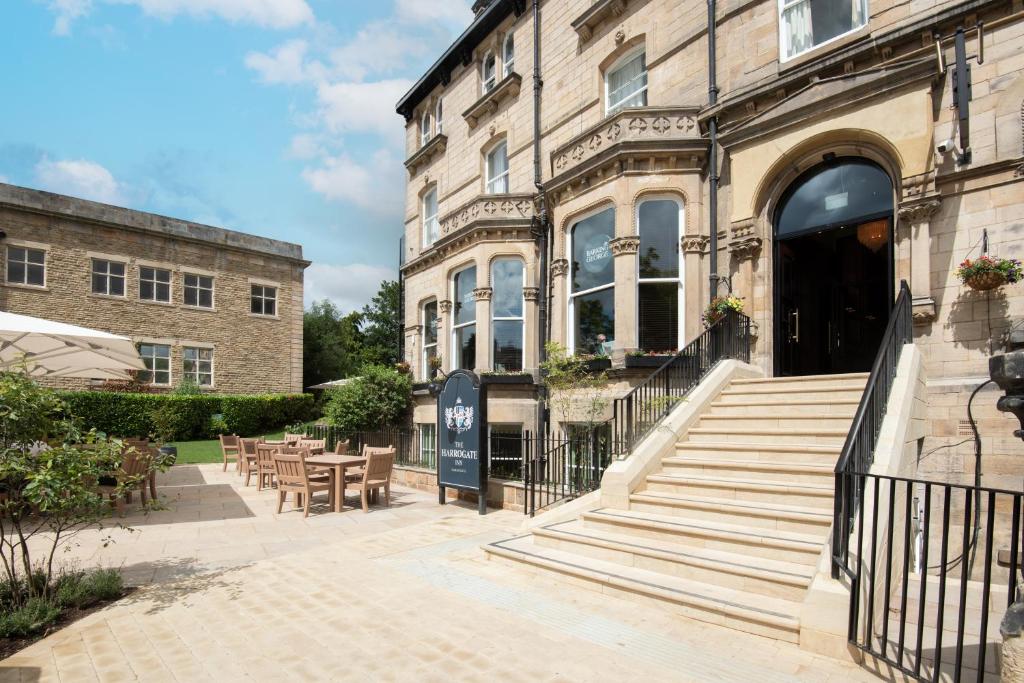 a building with tables and chairs in front of it at The Harrogate Inn - The Inn Collection Group in Harrogate