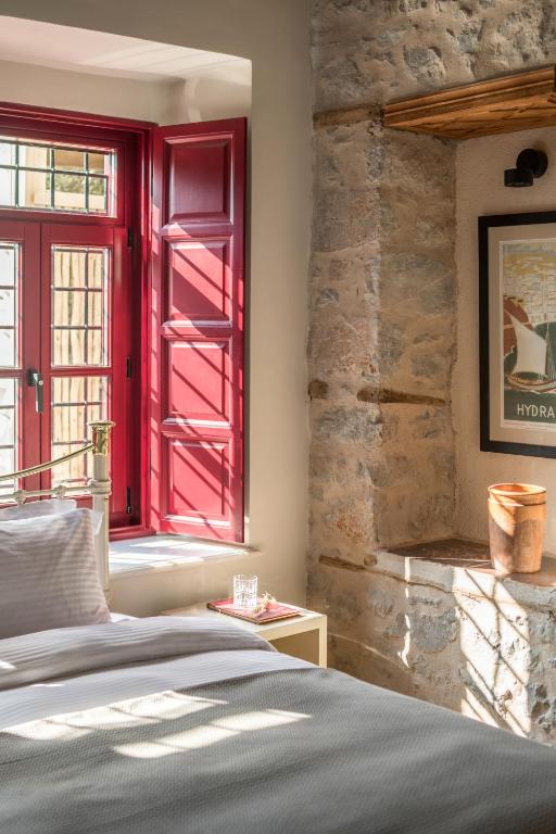Letto o letti in una camera di FOS Hydra residence