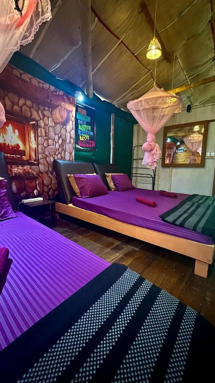 Postel nebo postele na pokoji v ubytování A Lounge Hostel And Cafe
