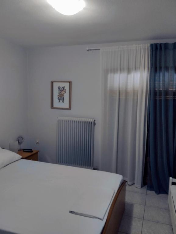 Posteľ alebo postele v izbe v ubytovaní Electra Apartment in Epidaurus