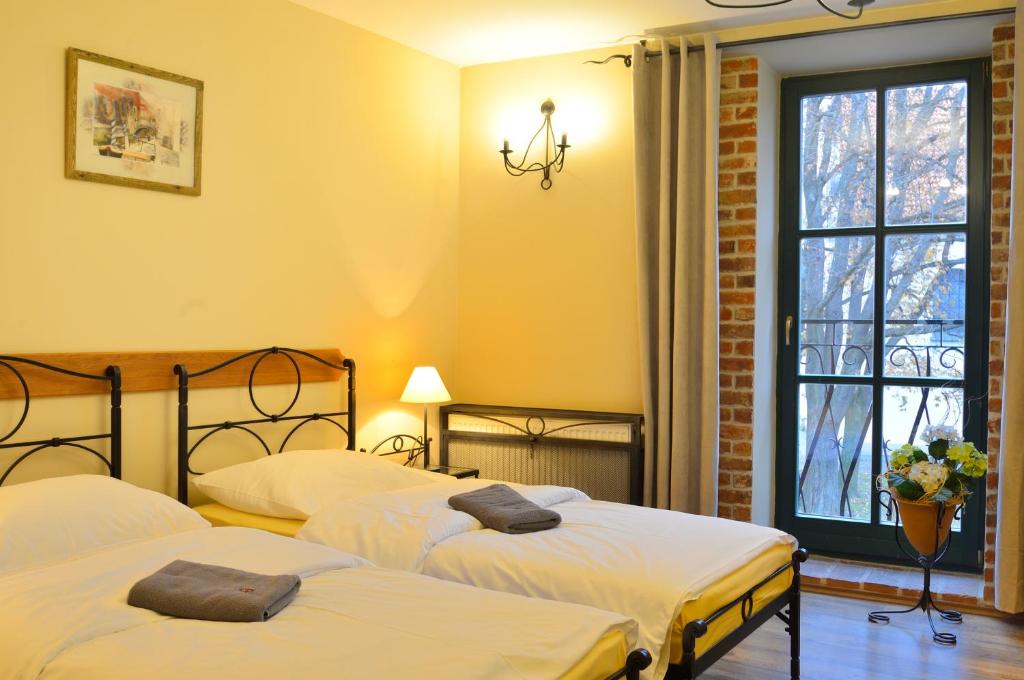 Postel nebo postele na pokoji v ubytování Hotel Via Ironia