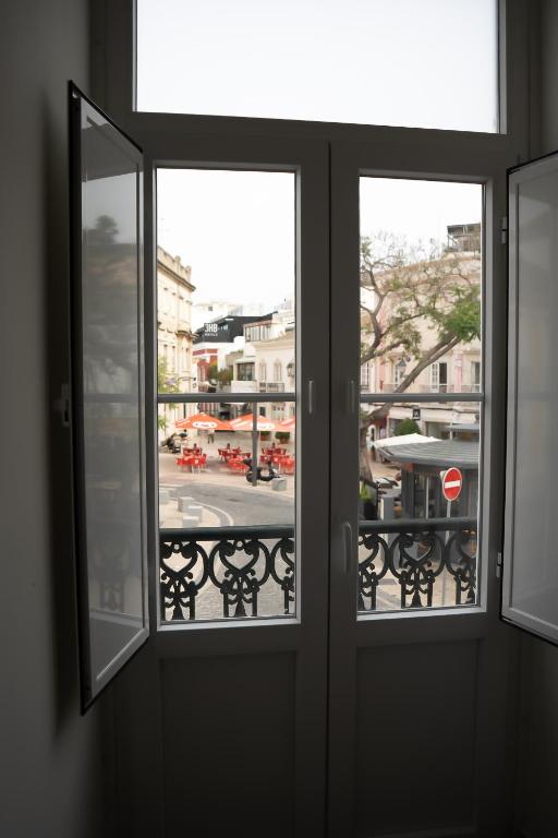 Balkón nebo terasa v ubytování Guest House Jacarandá Faro