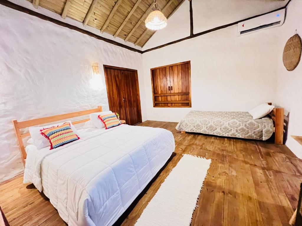 Postel nebo postele na pokoji v ubytování Villa Sagui Trancoso