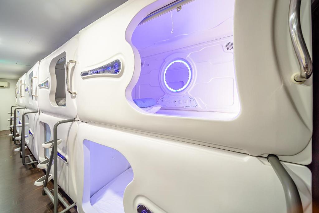 an aisle of an airplane with a row of seats at K Space Inn 14 in Singapore
