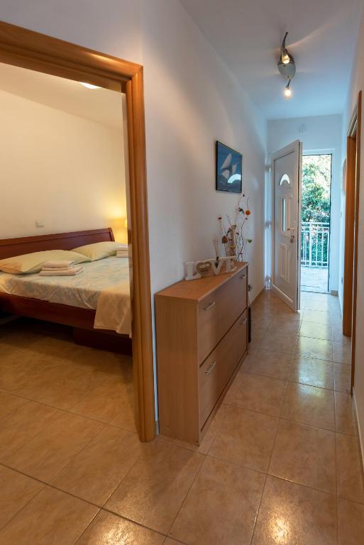 Posteľ alebo postele v izbe v ubytovaní Apartment Anamaria with Seaview