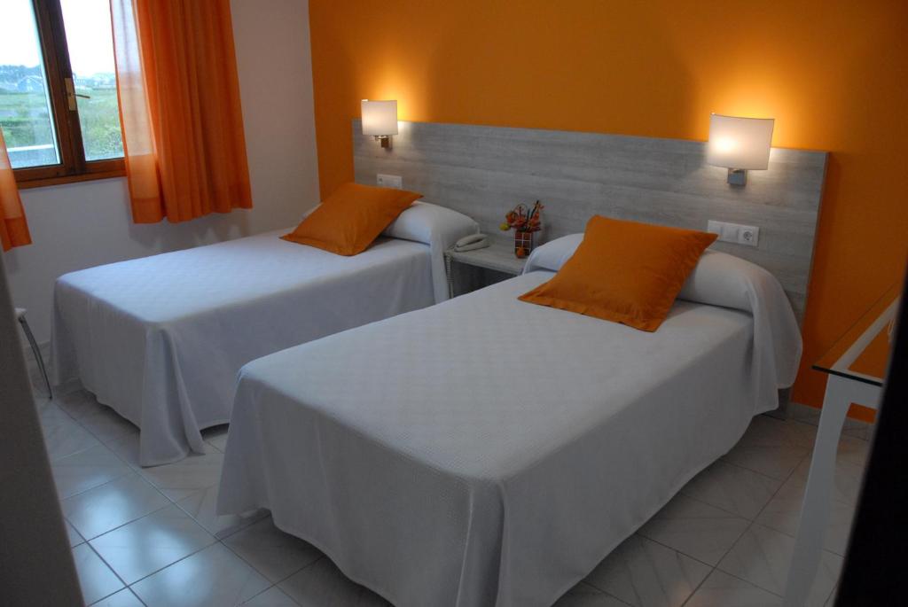 Postel nebo postele na pokoji v ubytování Hotel Las Catedrales