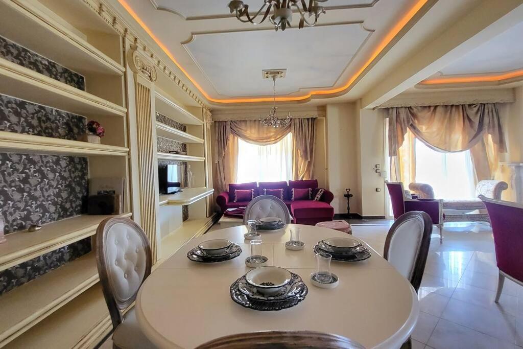 a dining room with a table and chairs at NoVel 1 Luxury apt Katerini in Katerini