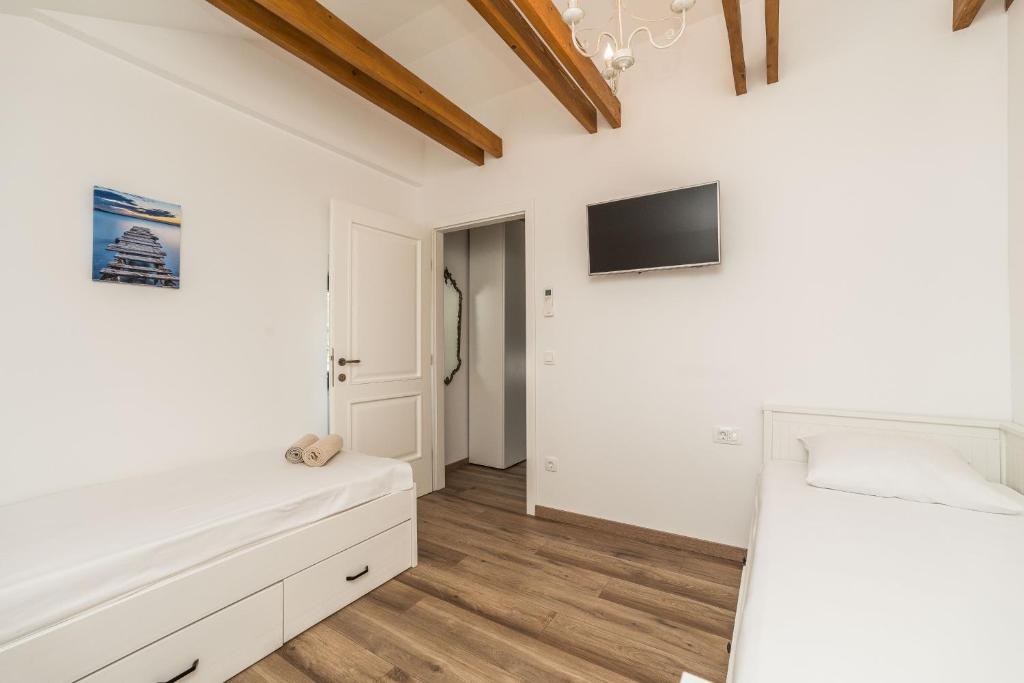 TV a/nebo společenská místnost v ubytování Stone House Luna