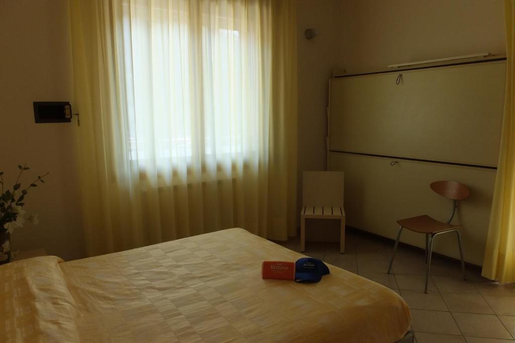 Postel nebo postele na pokoji v ubytování Hotel Nettuno