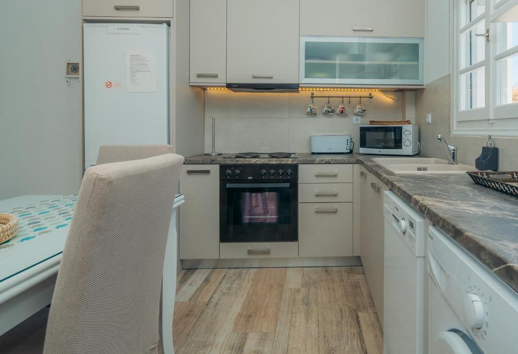 A kitchen or kitchenette at Erifili Houses
