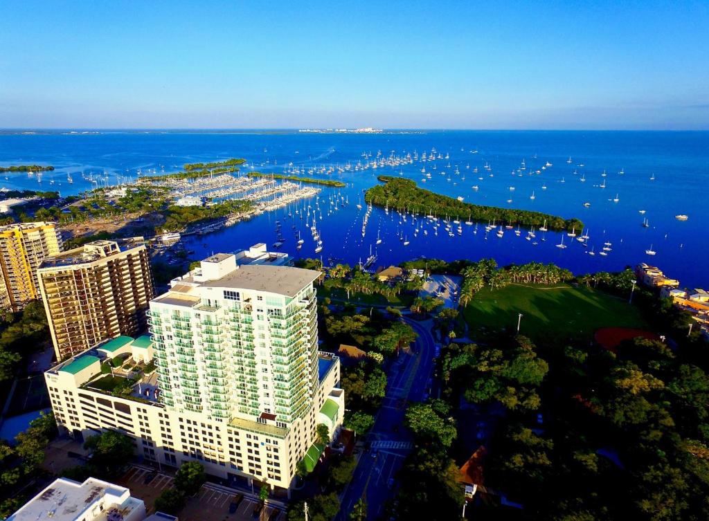 an aerial view of a city and the water at iCoconutGrove - Luxurious Vacation Rentals in Coconut Grove in Miami