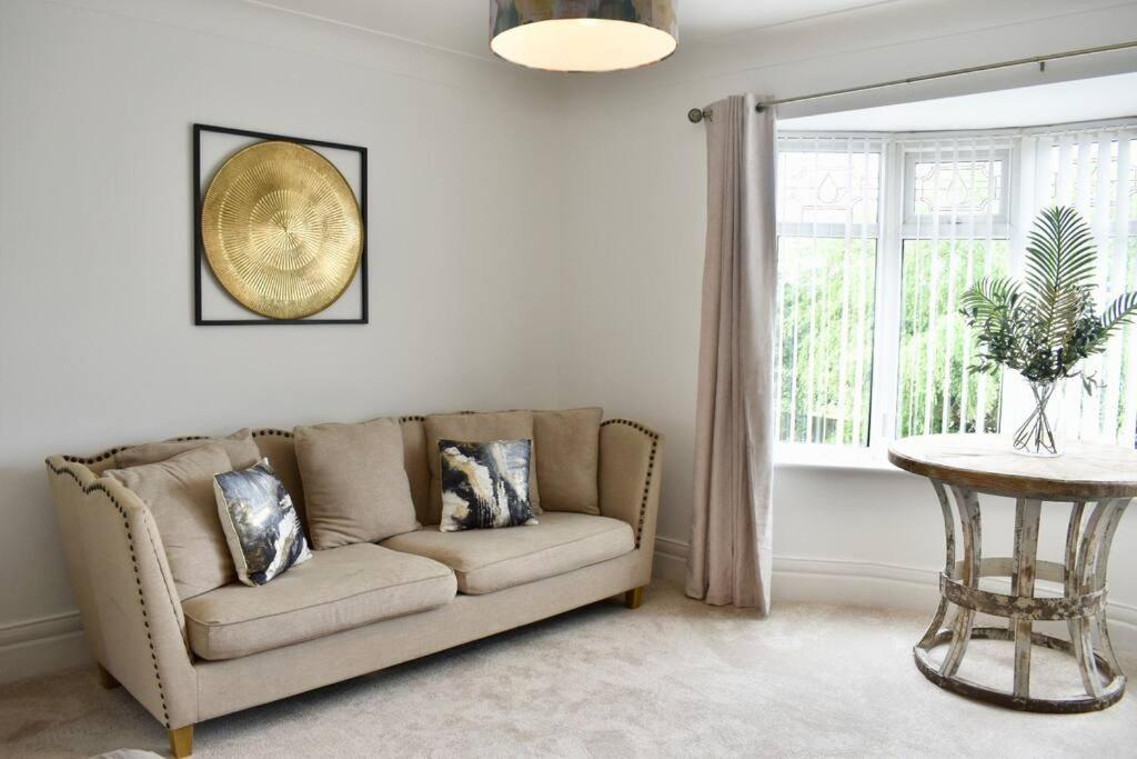 a living room with a couch and a table at 2 Bedroom Apartment in Gateshead in Gateshead