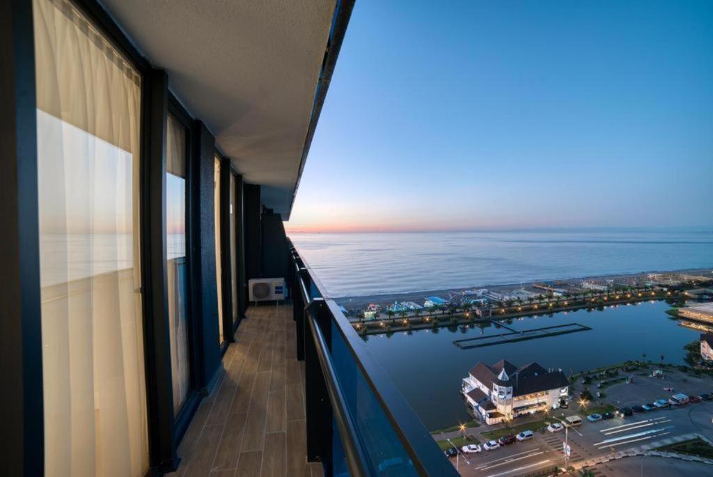 a view of the ocean from a balcony of a building at Orbi City Hotel Group Batumi in Batumi