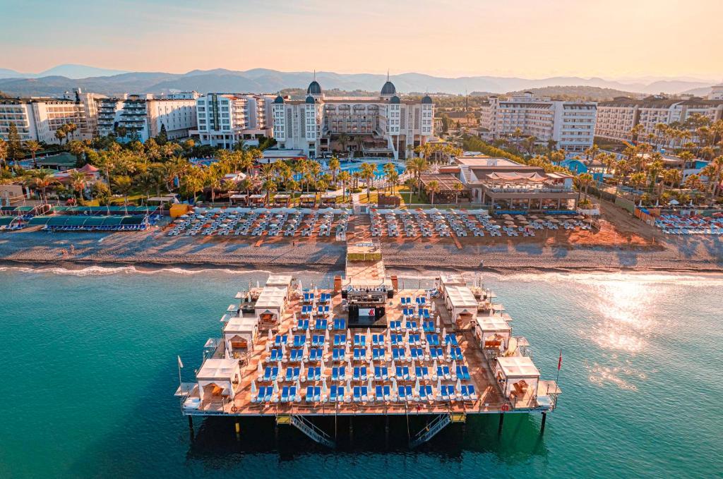 an aerial view of a resort on the water at Kirman Sidera Luxury & Spa in Okurcalar