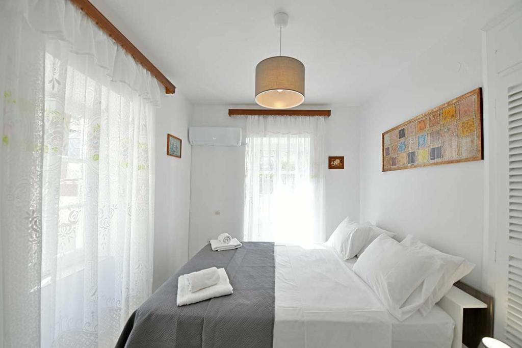 Postel nebo postele na pokoji v ubytování Margarita's House