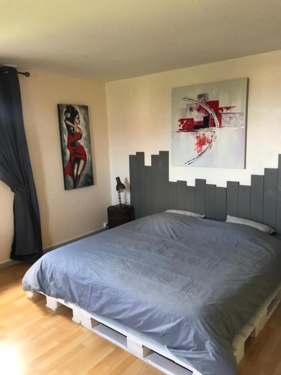 Postel nebo postele na pokoji v ubytování Chambre d'hôtes "COQUELICOT"