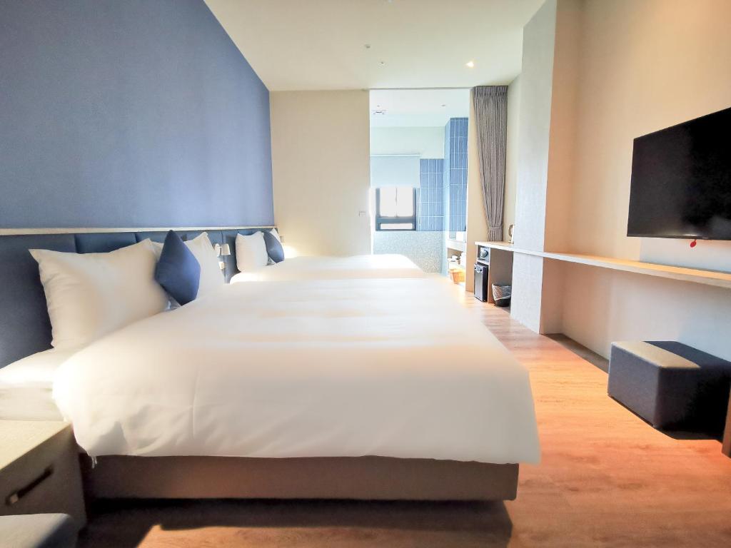 Postel nebo postele na pokoji v ubytování Hotel Sandao