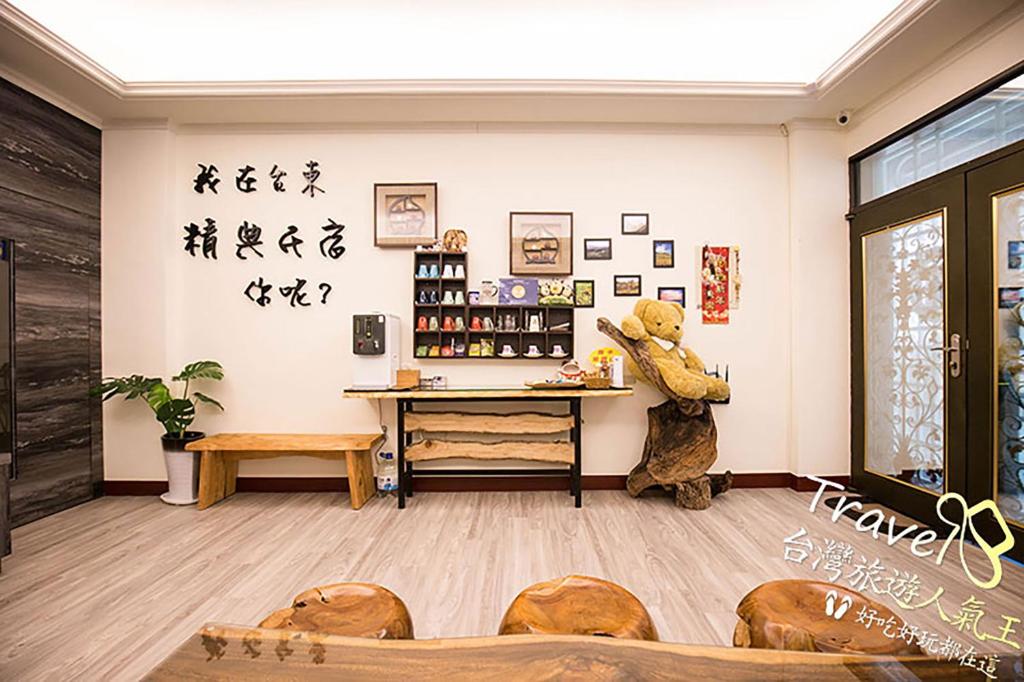 a teddy bear standing in the corner of a room at Jing Dian Homestay in Taitung City