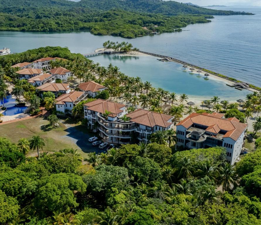an aerial view of a resort on the water at Beachfront Condo directly on the private beach - Ground Floor in Six Huts