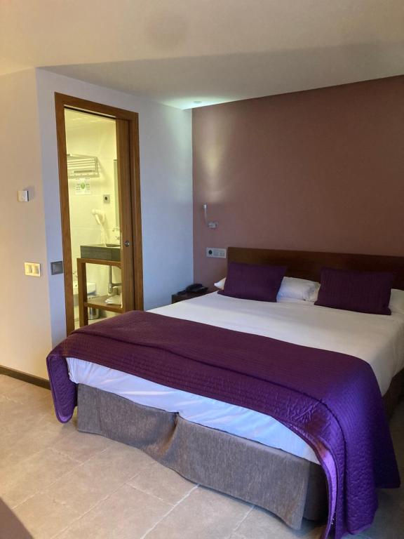 Postel nebo postele na pokoji v ubytování Hotel Palacio del Obispo