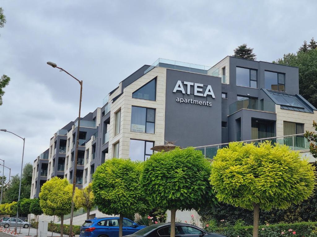 un edificio con un cartel en el costado en ATEA apartments en Kavarna