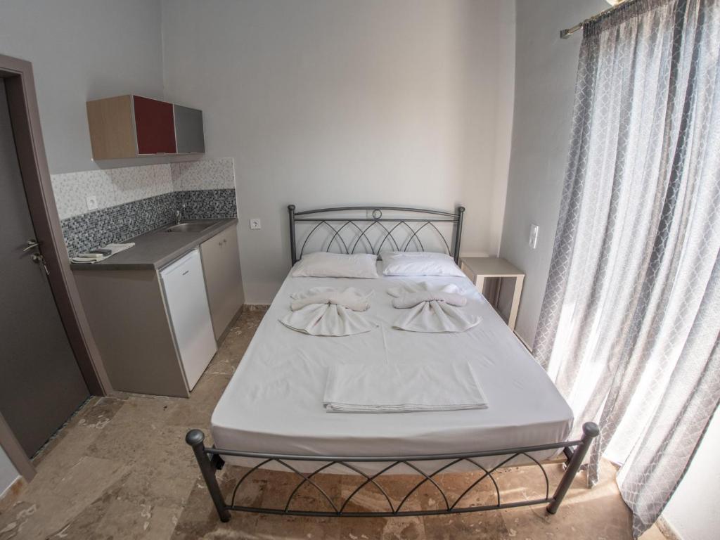 Postel nebo postele na pokoji v ubytování Pavlopetri
