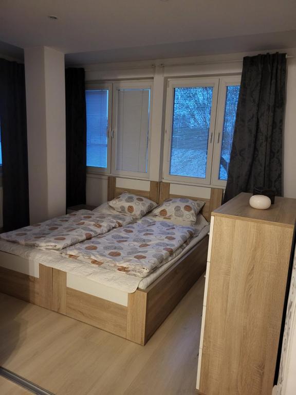 Postel nebo postele na pokoji v ubytování Zwaan Apartmány