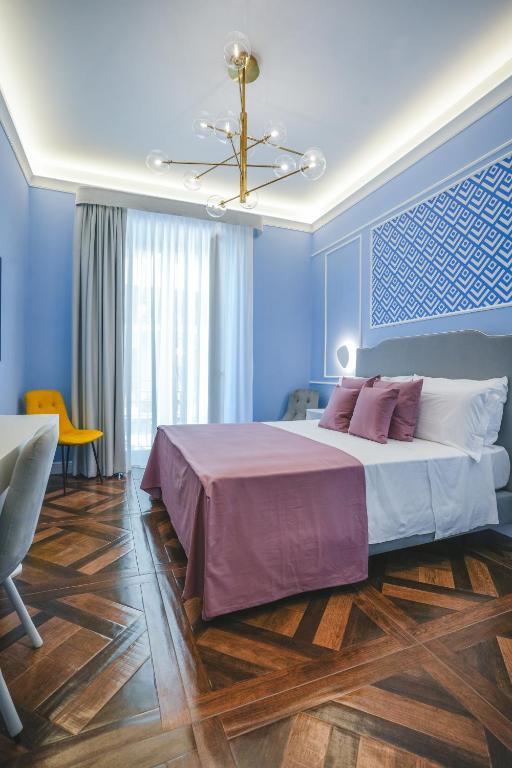 Postel nebo postele na pokoji v ubytování Cafè Latino Suites