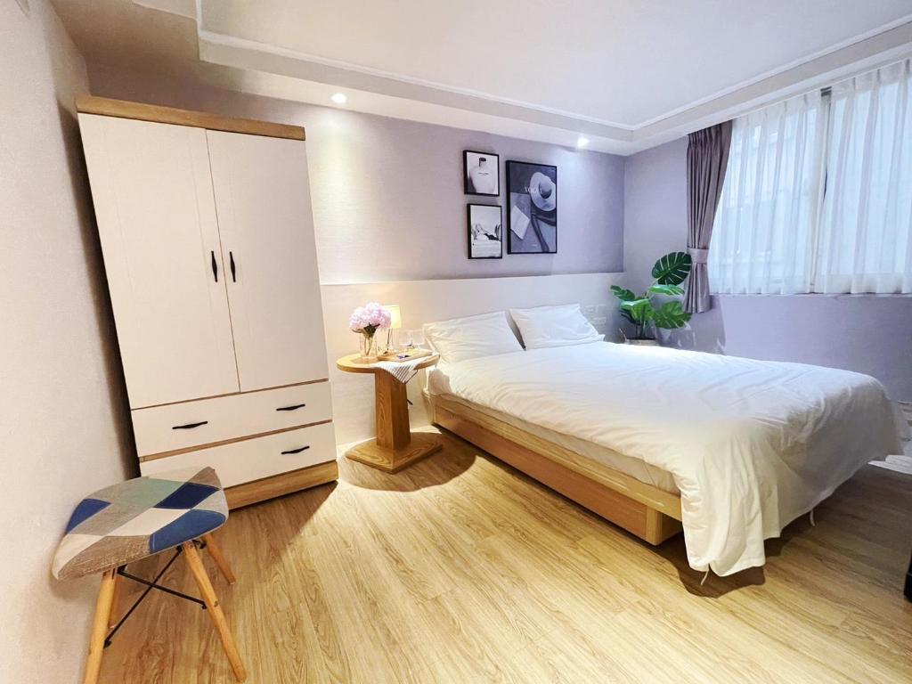 Postel nebo postele na pokoji v ubytování Meworld Hotel - Zhongshan