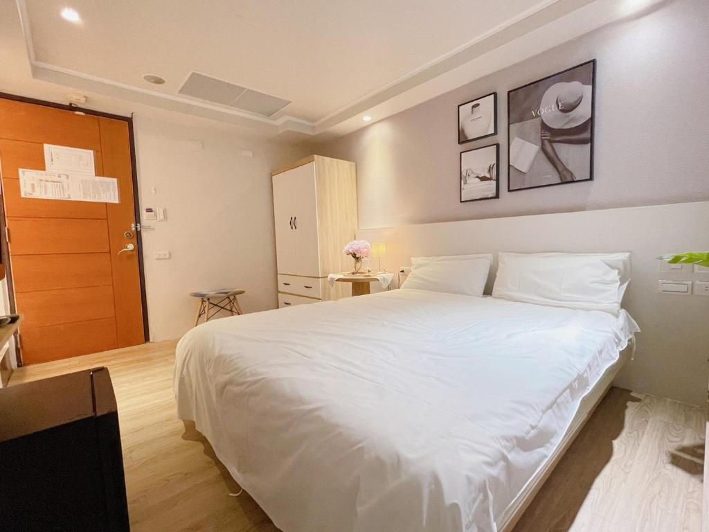 Postel nebo postele na pokoji v ubytování Meworld Hotel - Zhongshan