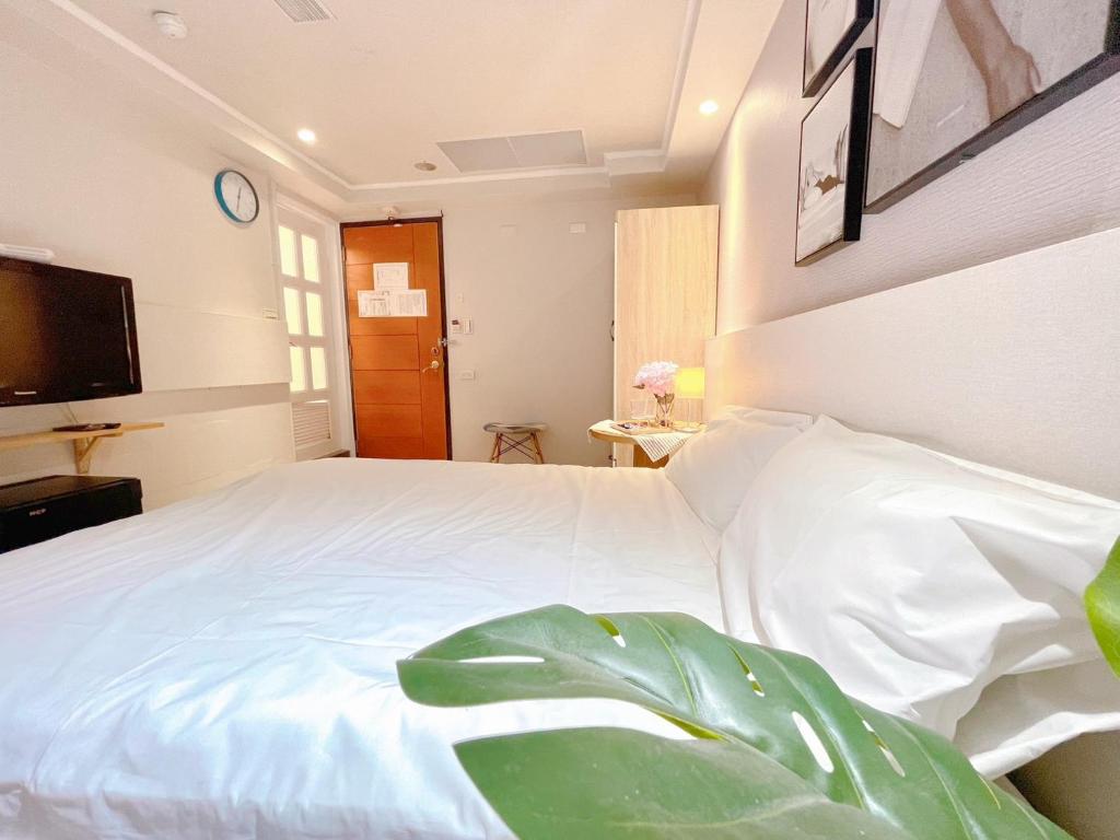 Postel nebo postele na pokoji v ubytování Meworld Hotel - Zhongshan