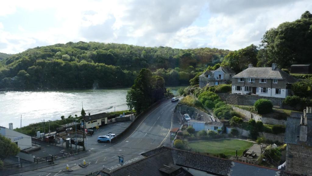 a view of a road next to a river at Admirals Apartment sleeps 4 adults 2 children EV Point in Looe