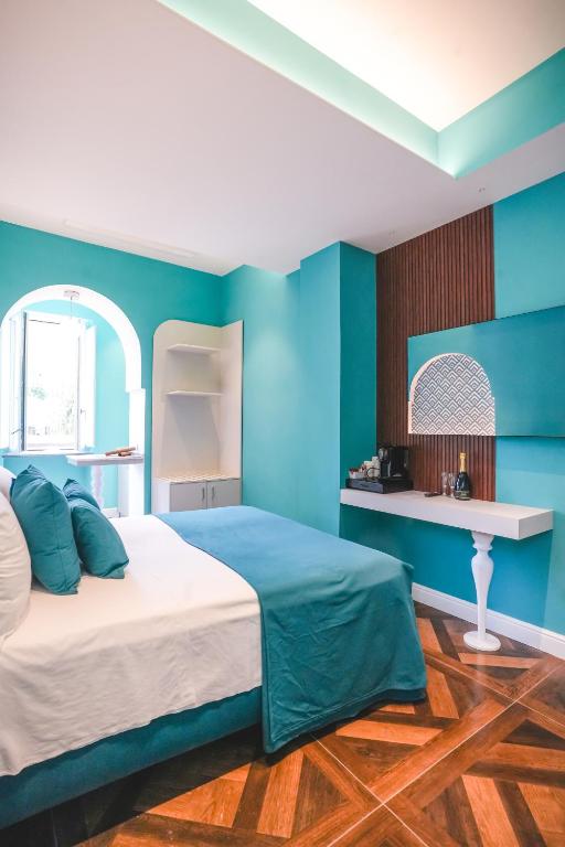 Postel nebo postele na pokoji v ubytování Cafè Latino Suites