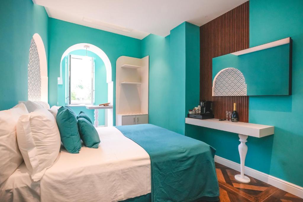 Postel nebo postele na pokoji v ubytování Cafè Latino Suites