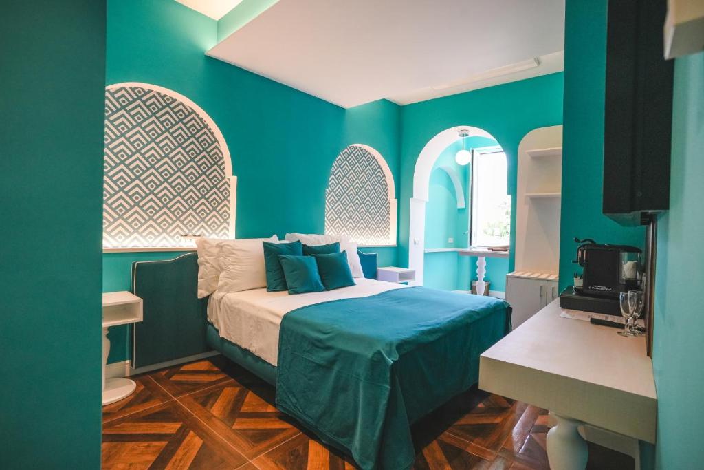 Postel nebo postele na pokoji v ubytování Cafè Latino Suites