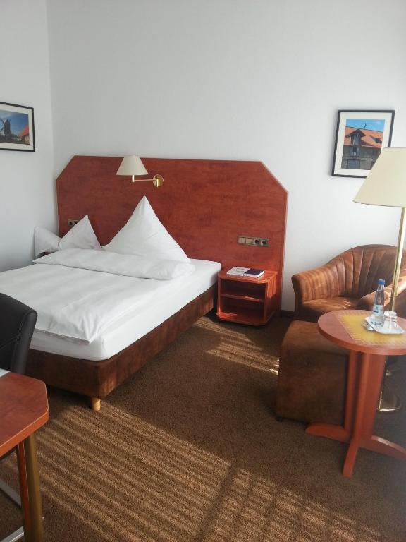 Postel nebo postele na pokoji v ubytování Hotel Quellenhof