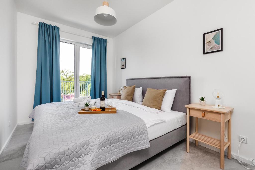 Postel nebo postele na pokoji v ubytování Apartamenty Pilice