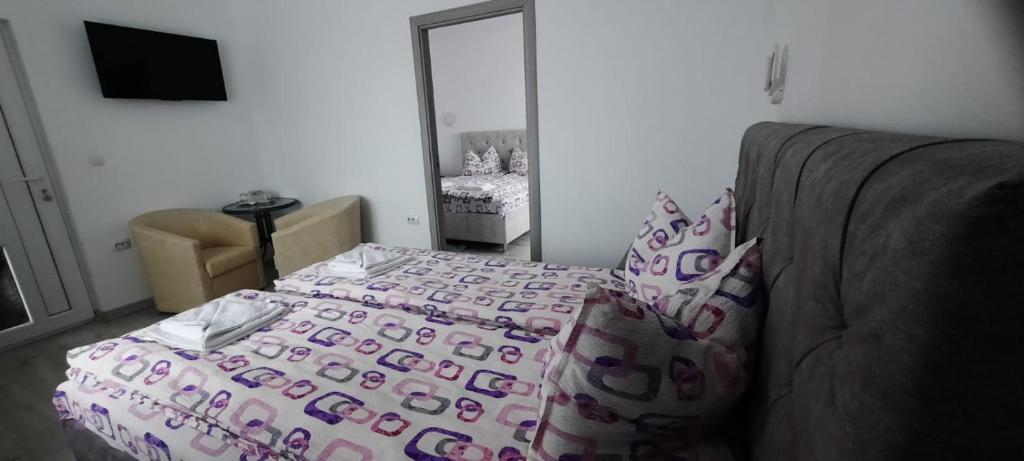 Postel nebo postele na pokoji v ubytování Casa Hărșan