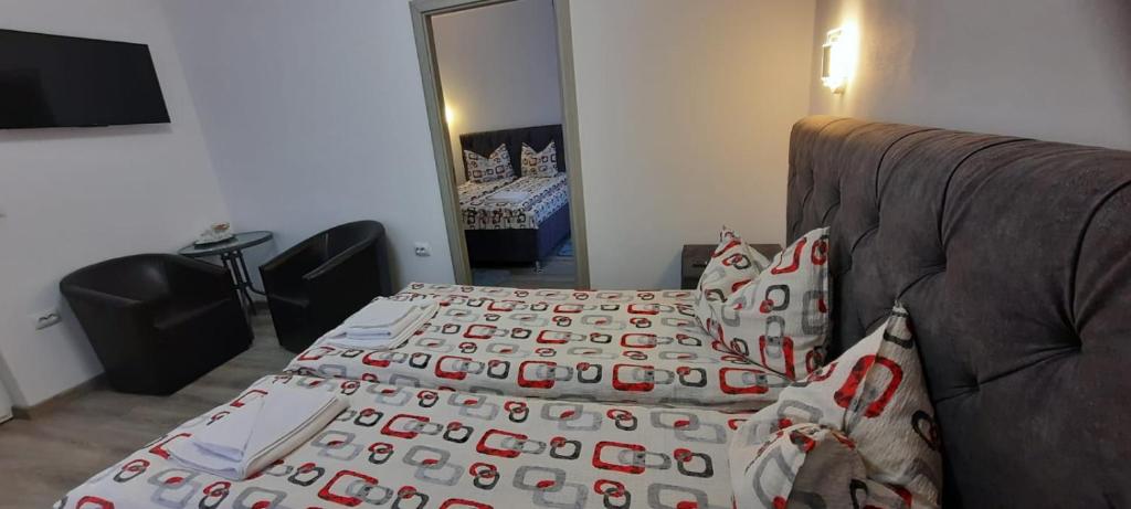 Postel nebo postele na pokoji v ubytování Casa Hărșan